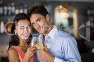 Couple toasting glasses of wine