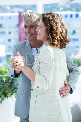 Smiling man holding woman hand