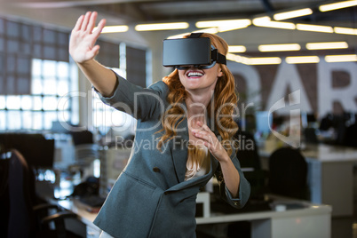 Cheerful woman using virtual reality simulator