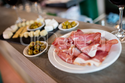 Meat and food on table in restaurant