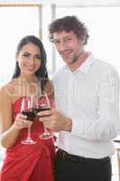 Couple toasting glasses of wine