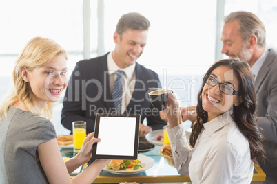 Business people having meal in restaurant