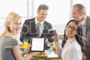 Business people having meal in restaurant