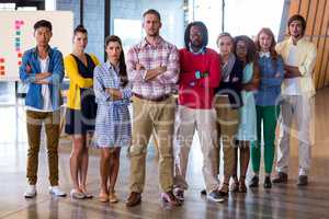 Young colleagues standing in office