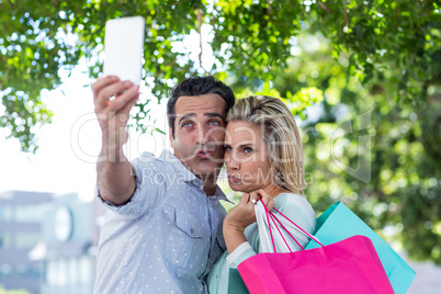 Couple puckering while taking selfie