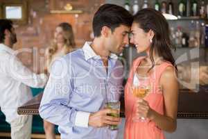 Romantic young couple holding wine glasses