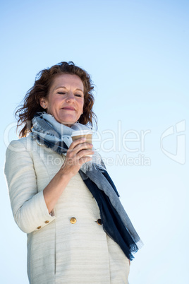 Woman holding coffee glass