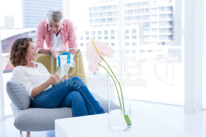 Man giving gift to woman during Valentines Day