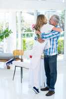 Woman embracing husband at restaurant