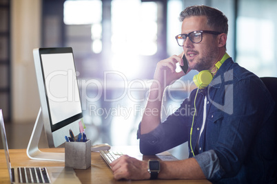 Man talking on phone in office