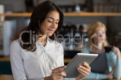 Close-up of businesswoman using digital tablet