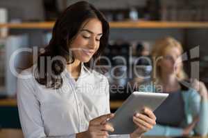 Close-up of businesswoman using digital tablet