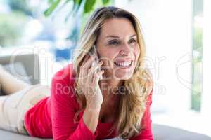 Woman smiling while talking on cellphone