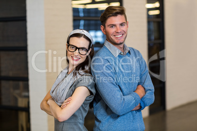 Young colleagues standing in office