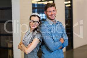 Young colleagues standing in office