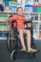 Disabled schoolboy in library
