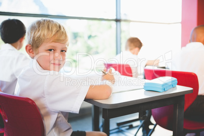 Schoolkids doing homework in classroom