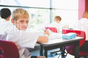 Schoolkids doing homework in classroom