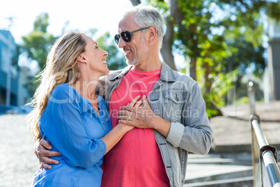 Romantic mature couple standing in city