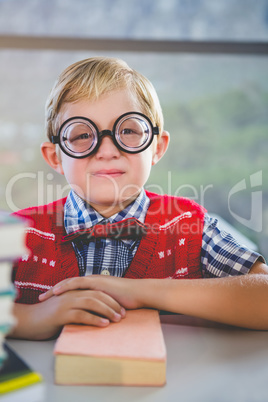 Close-up of schoolkid pretending to be a teacher in classroom