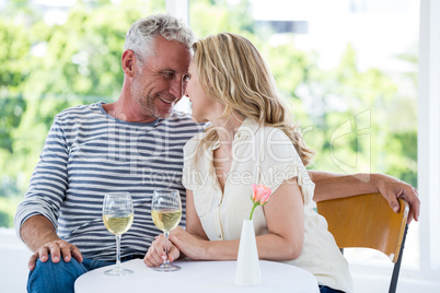 Romantic mature couple with white wine