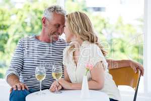 Romantic mature couple with white wine