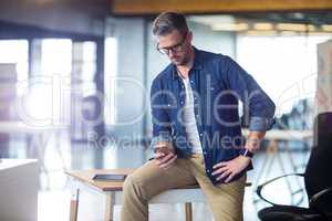 Man using mobile phone in office