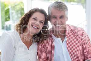 Smiling mature couple in restaurant