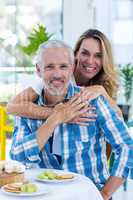 Happy mature couple in restaurant