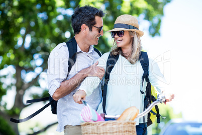 Couple with bicycle on street