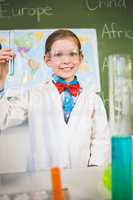 Portrait of schoolgirl doing a chemical experiment in laboratory