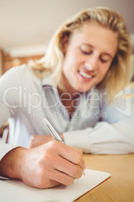 Man writing on a book