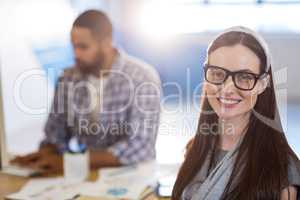 Businesswoman with colleague in office