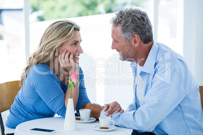 Romantic couple sitting at restaurant