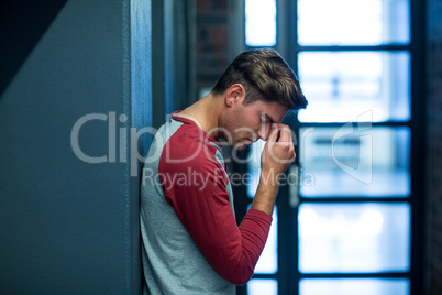 Stressed man by window