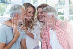 Mature couples against window in restaurant