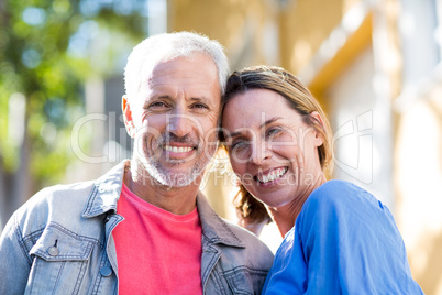 Happy mature couple in city