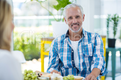 Happy man with woman at in restaurant