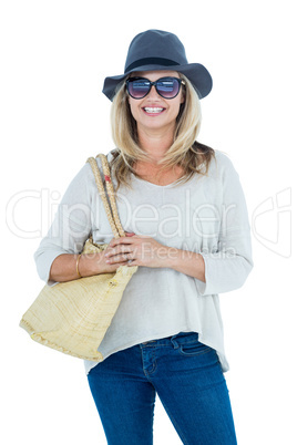 Cheerful mid adult woman standing against white background