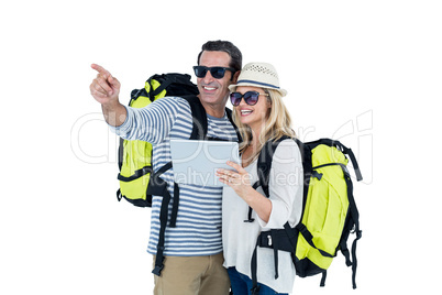 Cheerful couple with luggage