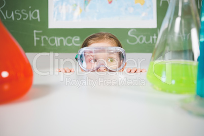 Schoolgirl doing a chemical experiment in laboratory