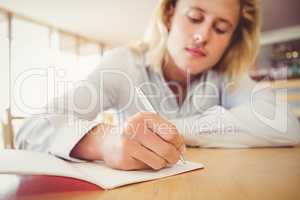 Man writing on a book