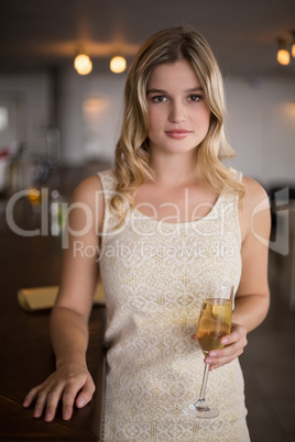 Portrait of beautiful woman holding a champagne flute