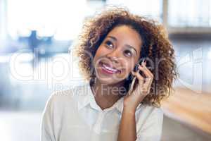 Smiling woman talking on phone