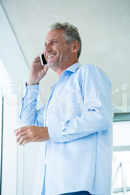 Low angle view of mature man talking on phone