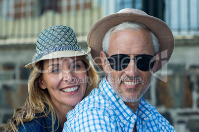 Smiling mature couple in city