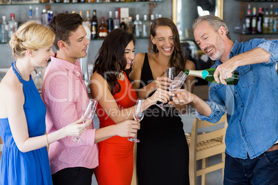 Man pouring champagne into glass