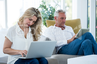 Mature couple using technology