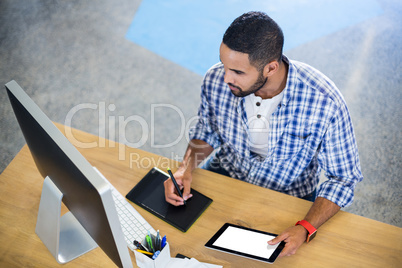 Businessman working at desk in office