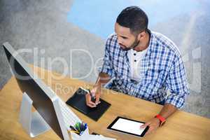 Businessman working at desk in office